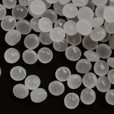 Close-up of translucent polyketone (POKETONE) granules, Hyosung’s high-performance engineering plastic