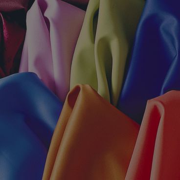 Stacked layers of high-performance spandex fabrics in various colors